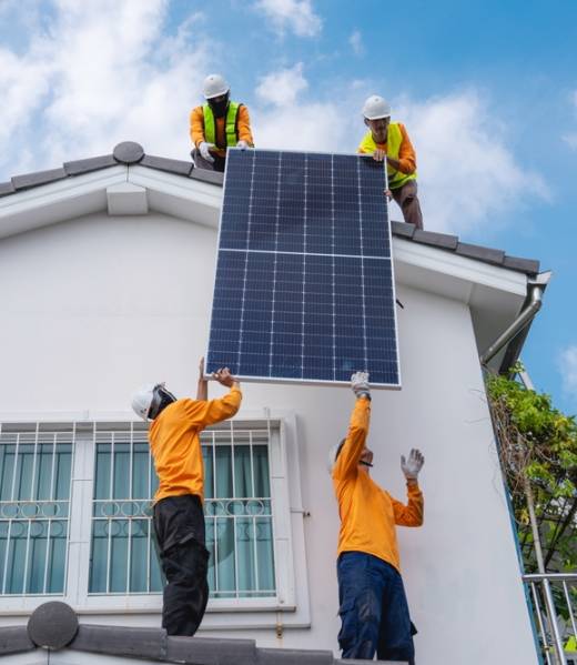 Service,Engineer,Installing,Solar,Cell,On,The,Roof,Of,House.