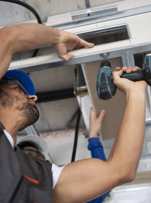 low-angle-people-working-with-drill